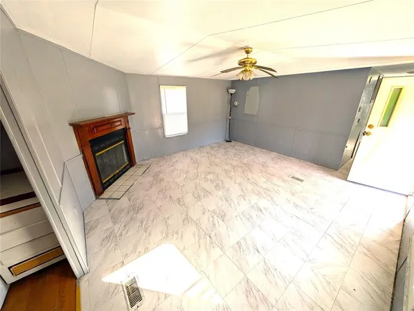 a view of a living room with a fireplace