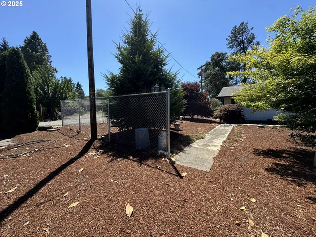 a view of a backyard with sitting area