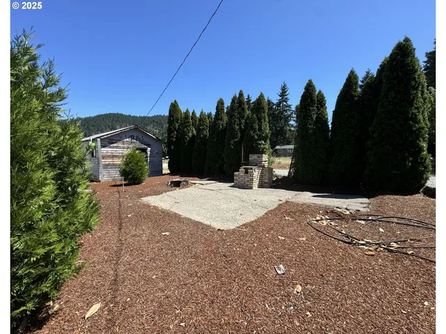 a view of a road with a building in the background