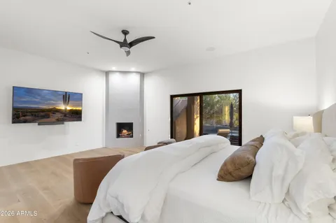 a bedroom with a bed and window