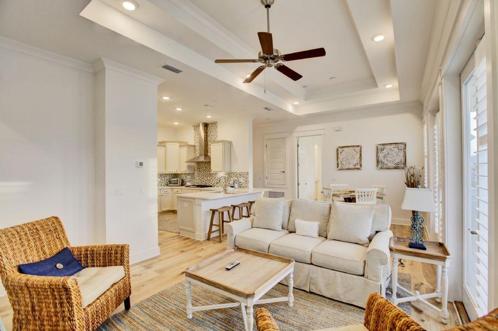 44 Pine Lands Loop Inlet Beach West, Unit C Inlet Beach, FL 32461 - Photo 1 of 27 a living room with furniture a ceiling fan and a rug