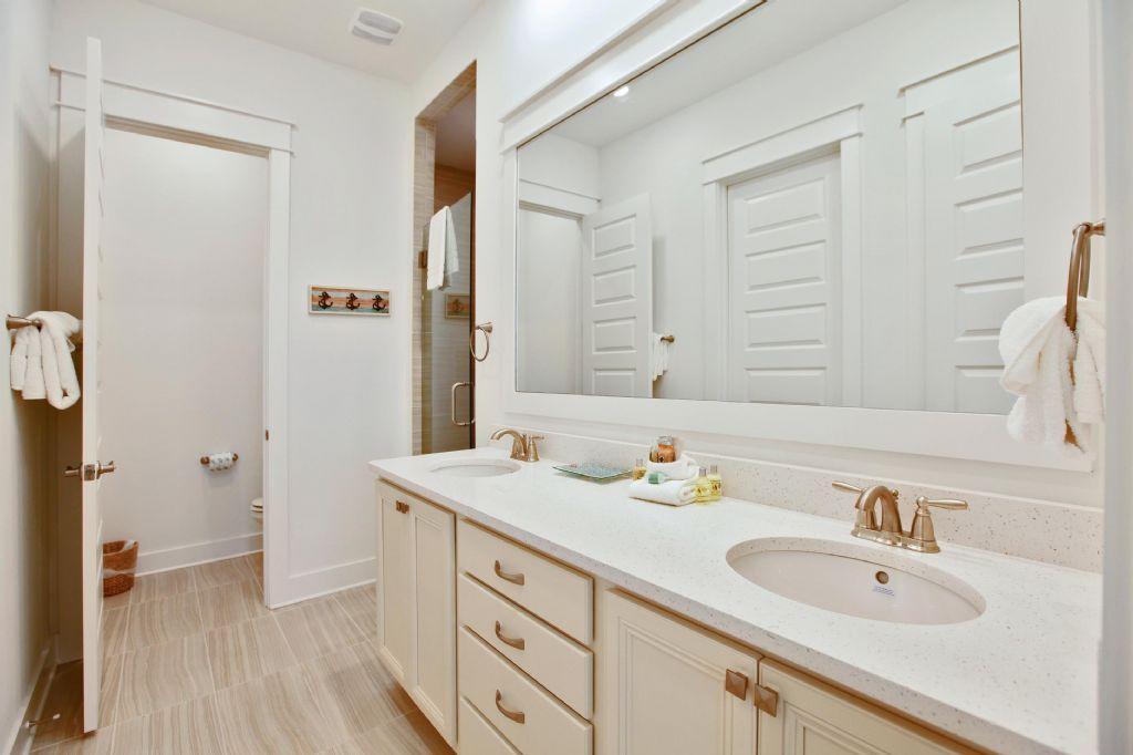 44 Pine Lands Loop Inlet Beach West, Unit C Inlet Beach, FL 32461 - Photo 7 of 27 a bathroom with a sink and a mirror