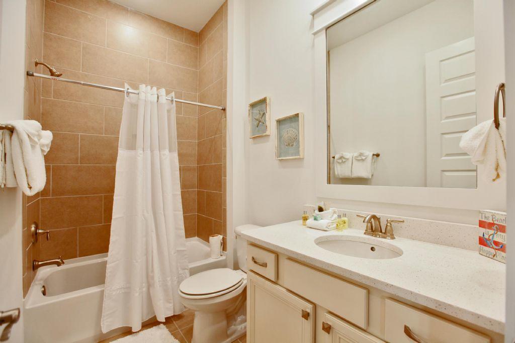 44 Pine Lands Loop Inlet Beach West, Unit C Inlet Beach, FL 32461 - Photo 9 of 27 a bathroom with a sink toilet and shower