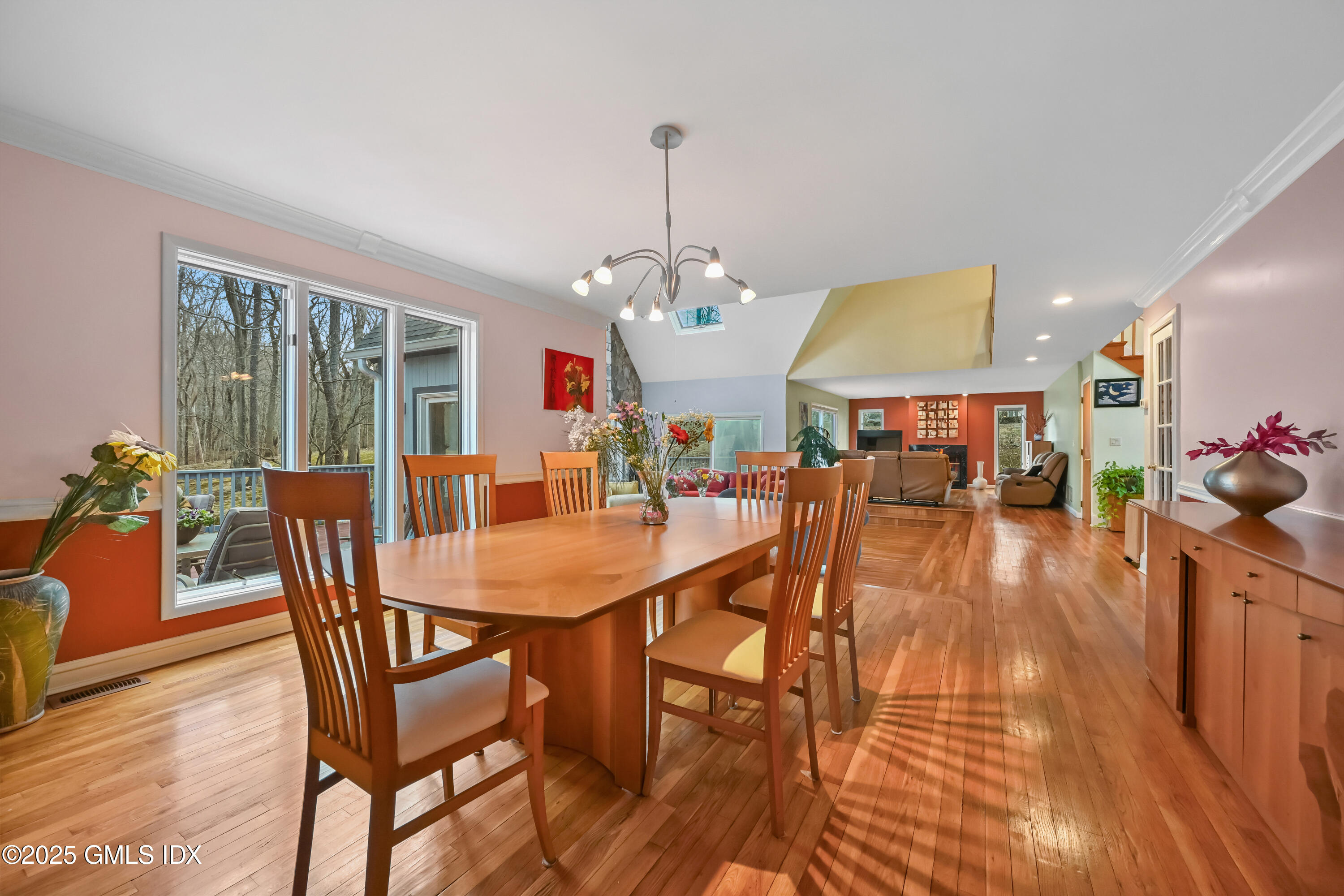 681 River Road Cos Cob, CT 06807 - Photo 13 of 44 a dining room with furniture a chandelier and wooden floor