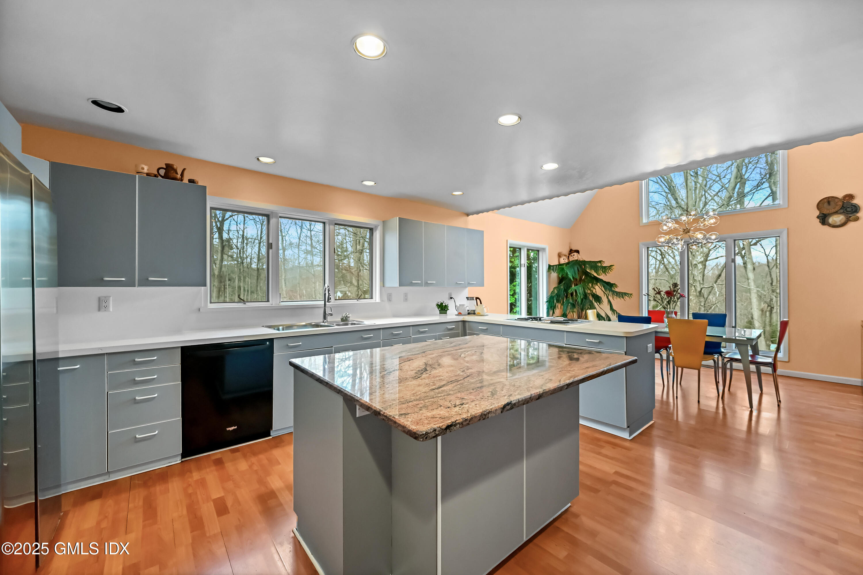 681 River Road Cos Cob, CT 06807 - Photo 14 of 44 a kitchen with counter top space sink and center island