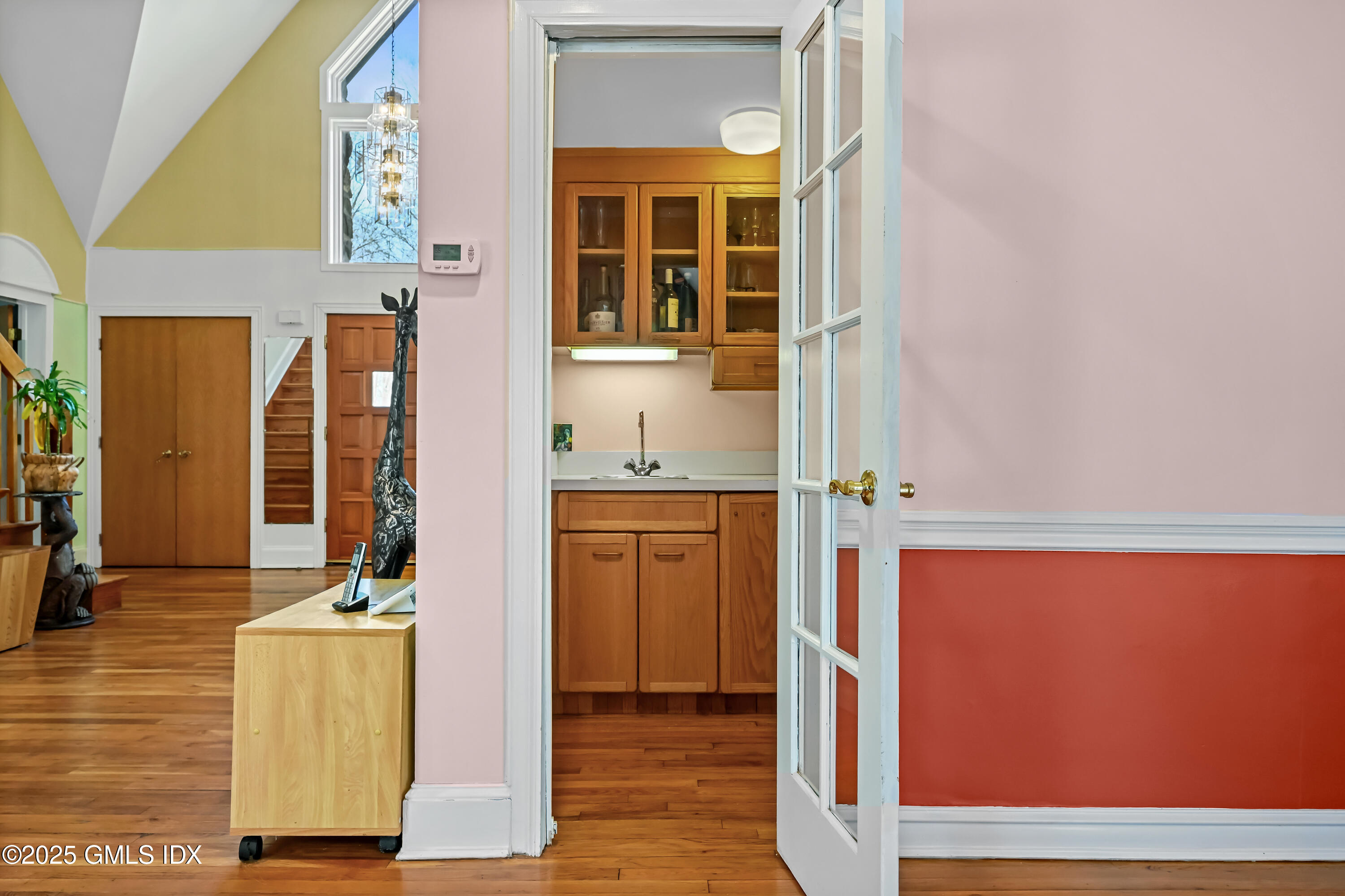 681 River Road Cos Cob, CT 06807 - Photo 20 of 44 hallway with wooden floor and windows