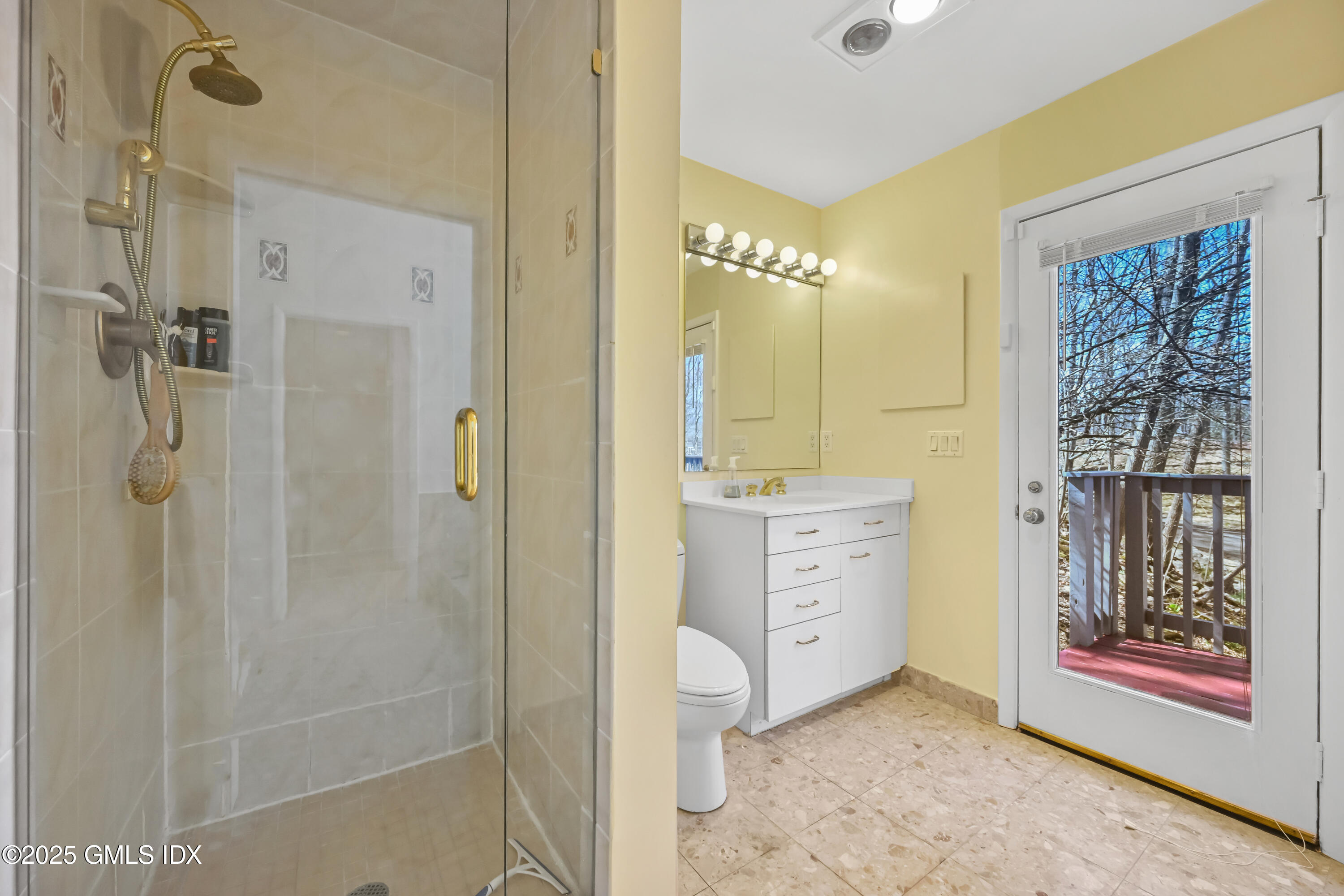681 River Road Cos Cob, CT 06807 - Photo 27 of 44 a bathroom with a shower sink and mirror