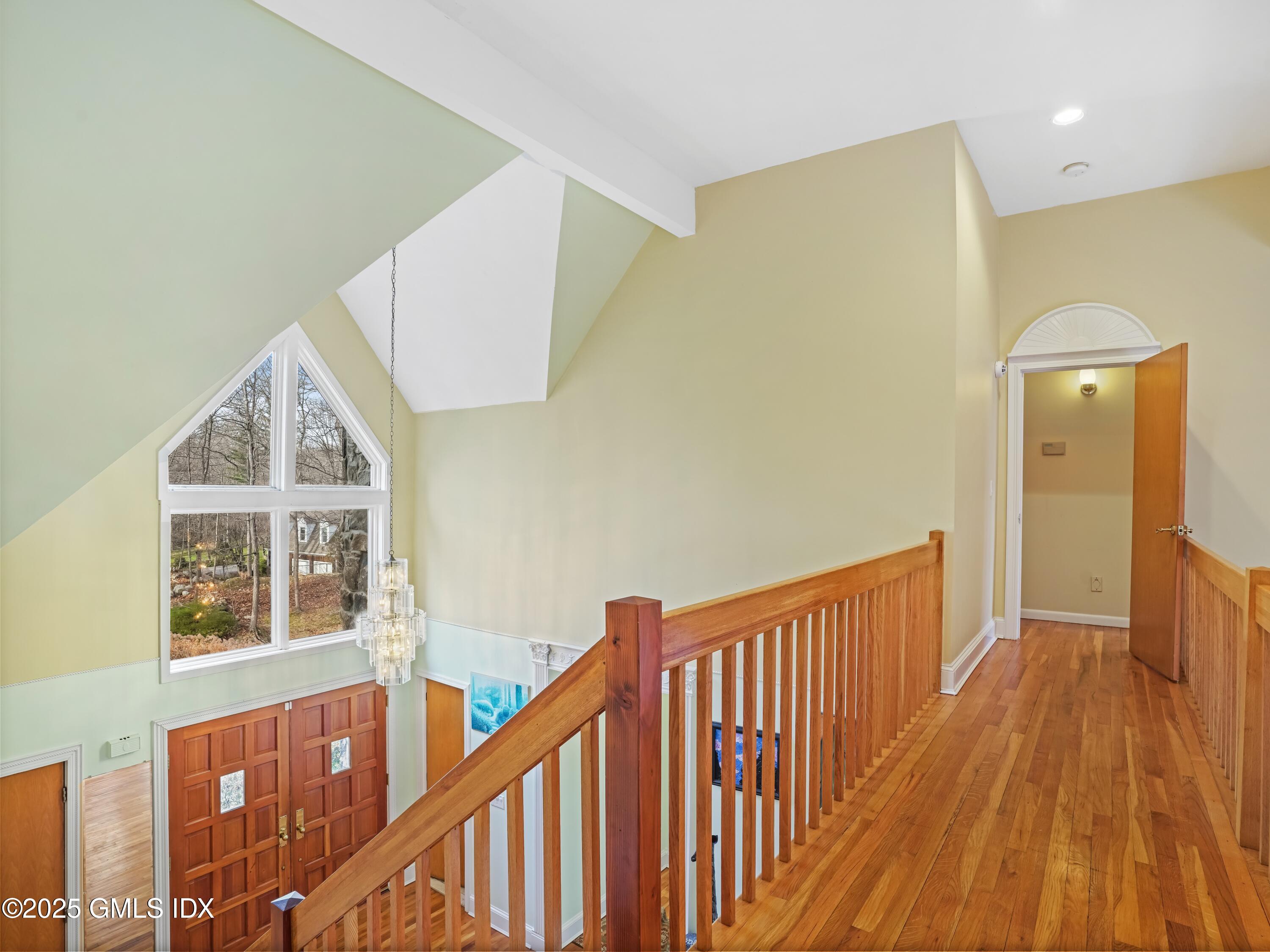 681 River Road Cos Cob, CT 06807 - Photo 28 of 44 a view of a hallway with wooden floor and staircase