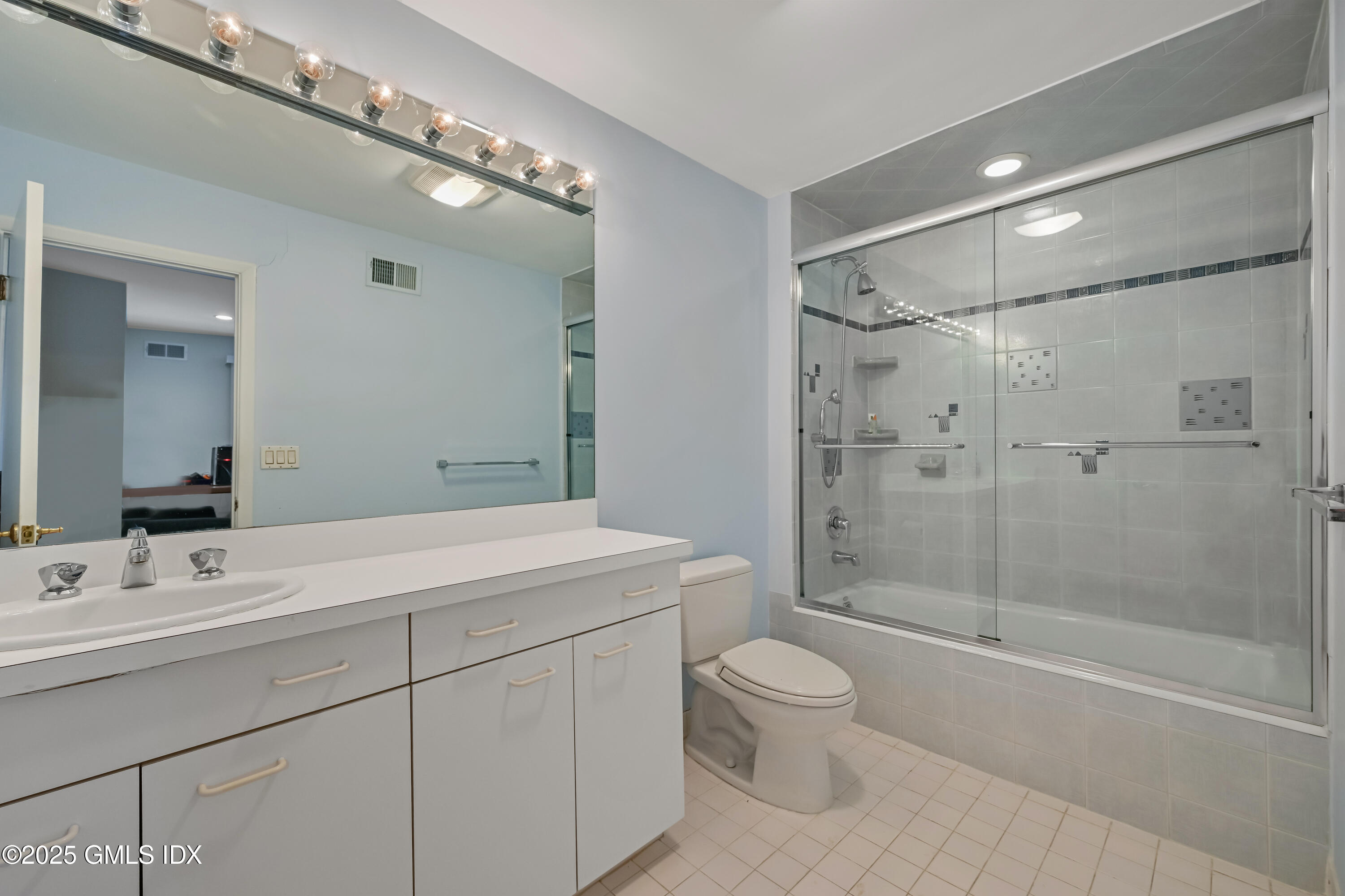 681 River Road Cos Cob, CT 06807 - Photo 31 of 44 a bathroom with a sink a toilet and shower