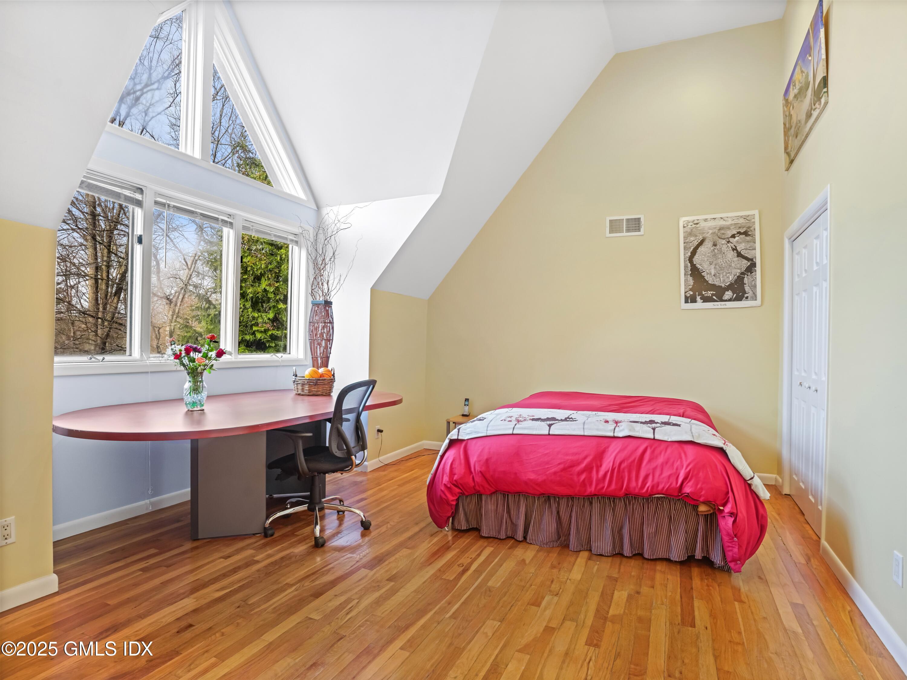 681 River Road Cos Cob, CT 06807 - Photo 32 of 44 a bedroom with a bed and a view of balcony