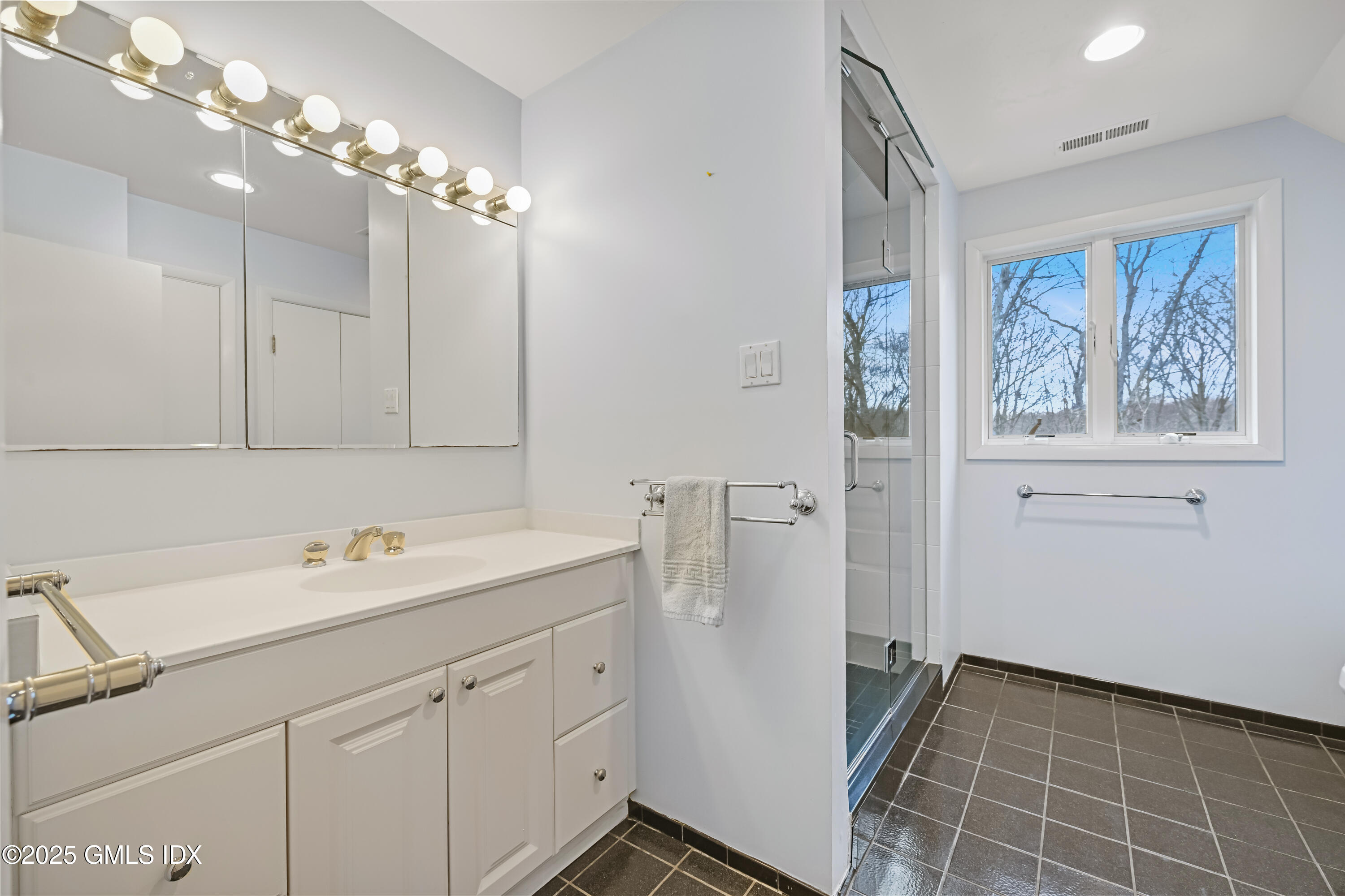 681 River Road Cos Cob, CT 06807 - Photo 35 of 44 a bathroom with a sink a vanity and a mirror