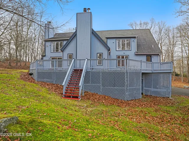 a house view with tall trees