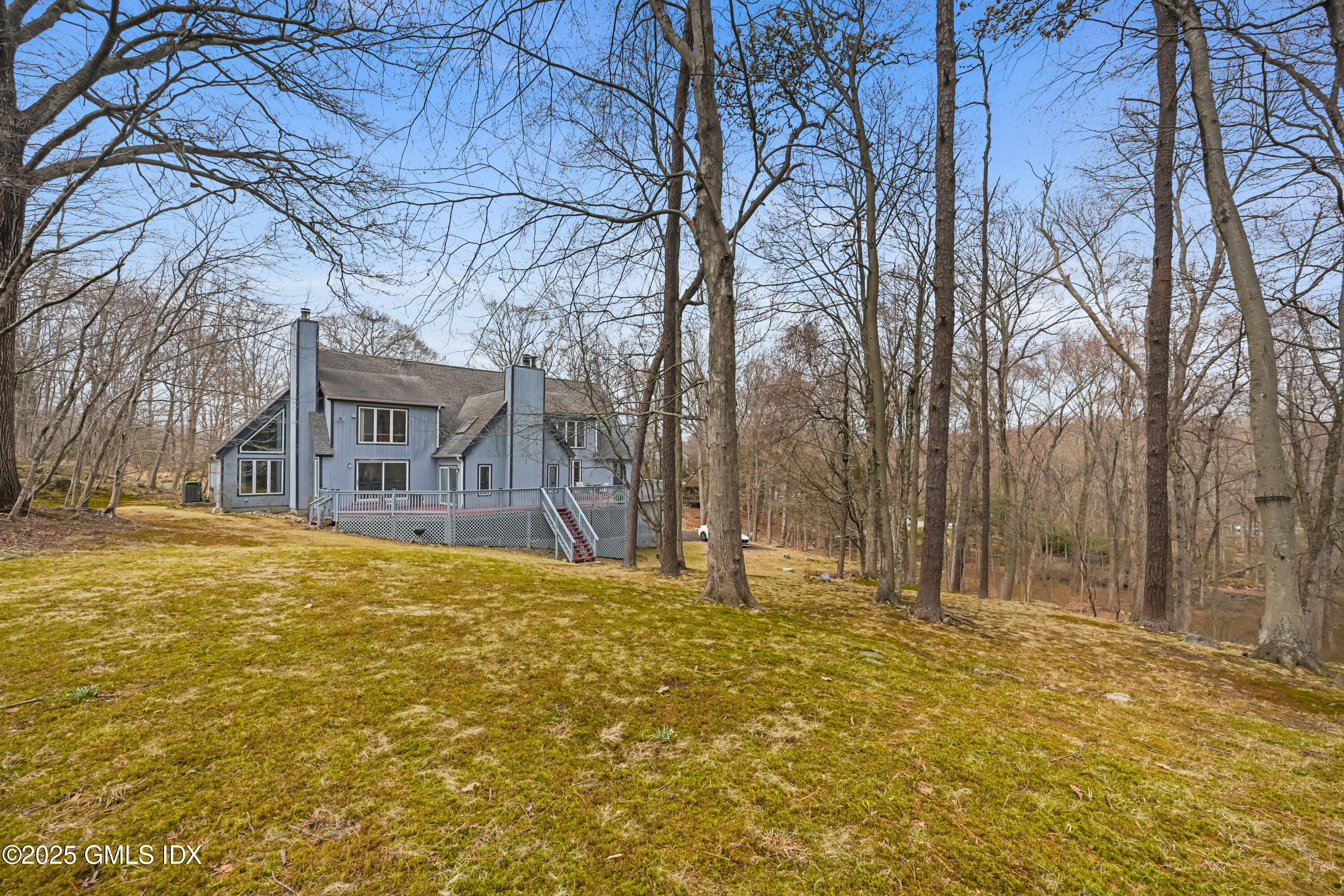 681 River Road Cos Cob, CT 06807 - Photo 41 of 44 a house view with tall trees