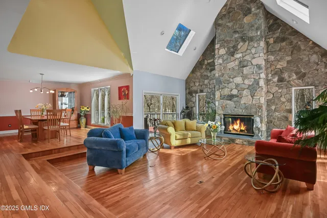 a living room with furniture and kitchen view