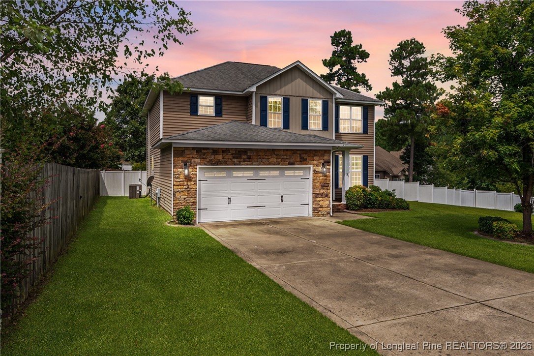 37 Annapolis Road Cameron, NC 28326 - Photo 2 of 2 a front view of a house with a garden and yard