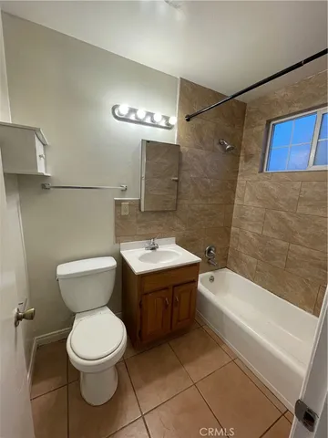 a bathroom with a sink a toilet and a bathtub