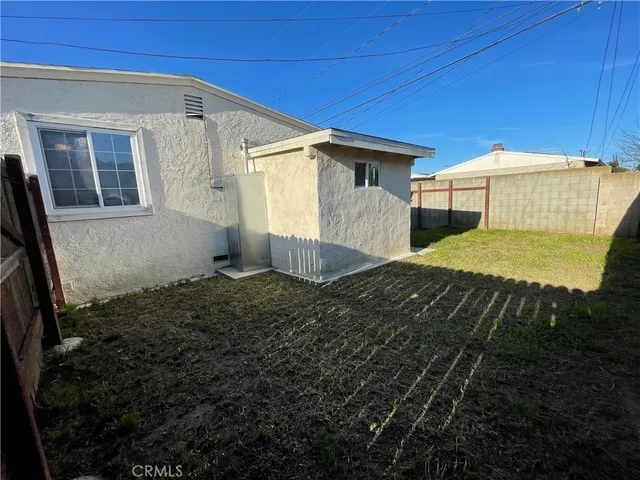 a house view with a backyard space