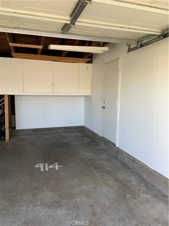 a view of a backyard with a wooden fence