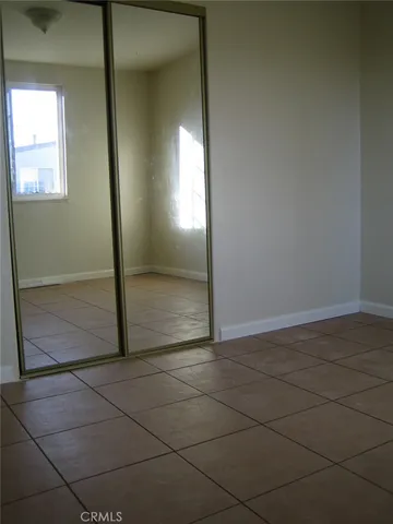 an empty room with a mirror