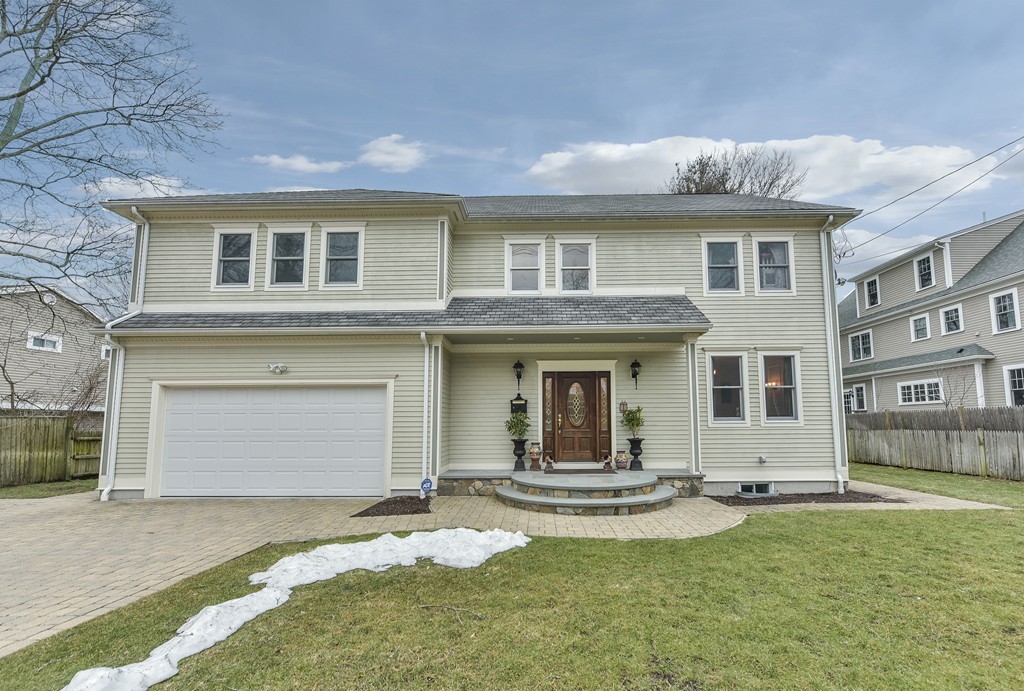 88 Wiswall Road Newton, MA 02459 - Photo 1 of 30 a front view of a house with a yard and garage