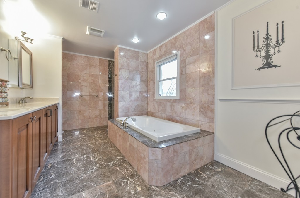 88 Wiswall Road Newton, MA 02459 - Photo 13 of 30 a spacious bathroom with a tub sink and mirror