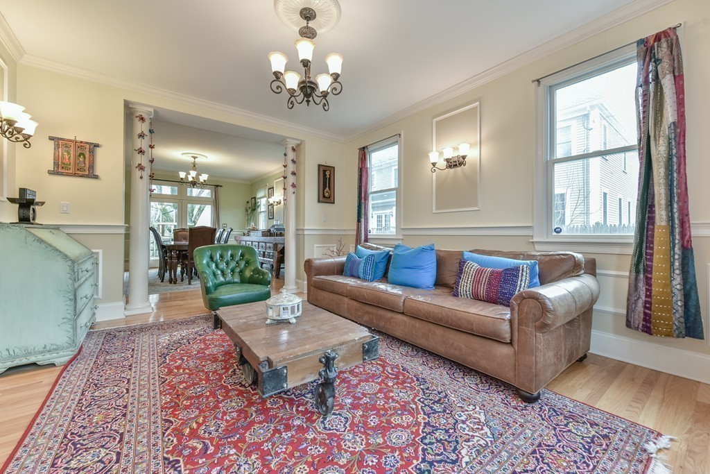 88 Wiswall Road Newton, MA 02459 - Photo 18 of 30 a living room with furniture and a chandelier