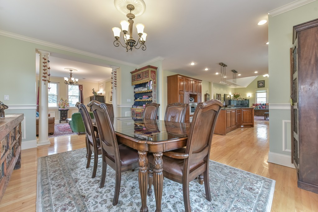 88 Wiswall Road Newton, MA 02459 - Photo 19 of 30 a dining room with furniture a chandelier and wooden floor