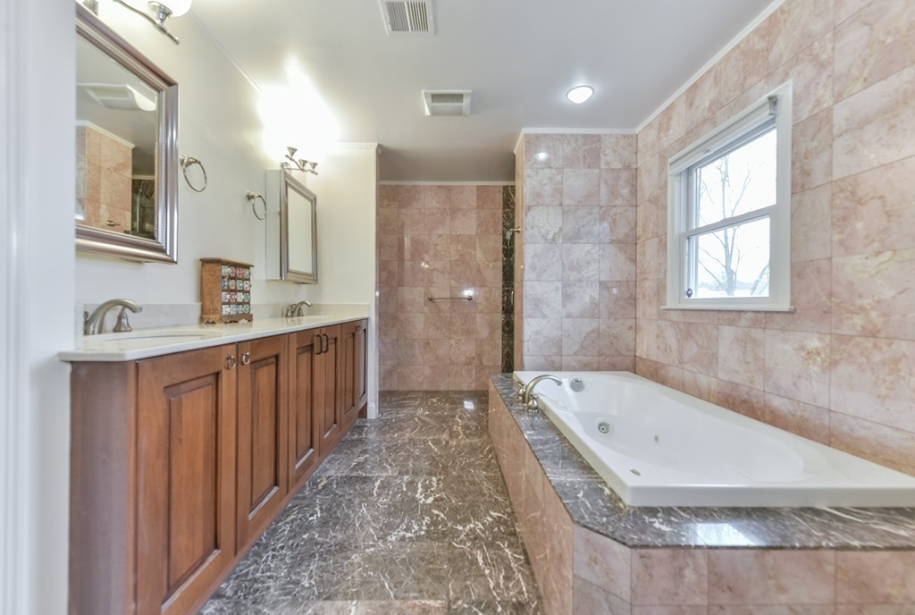 88 Wiswall Road Newton, MA 02459 - Photo 9 of 30 a bathroom with a tub a sink and a mirror