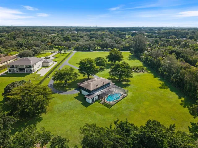 an aerial view of a house with a garden