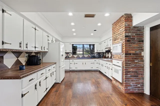 a lobby with furniture and chandelier