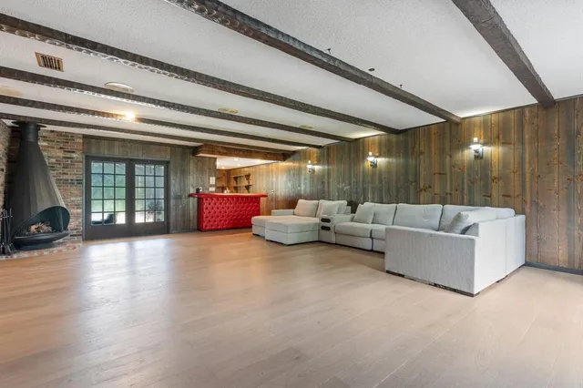 a kitchen with stainless steel appliances kitchen island granite countertop a sink and cabinets