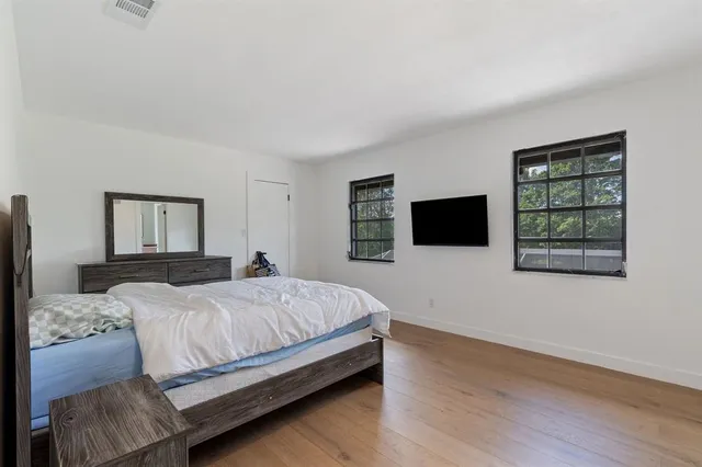 a bedroom with a bed and a table