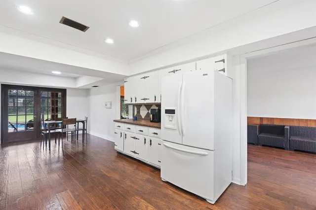 a kitchen with granite countertop a sink and a stove