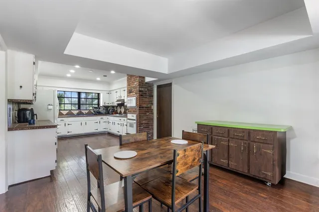 a spacious bedroom with a large bed and a large window