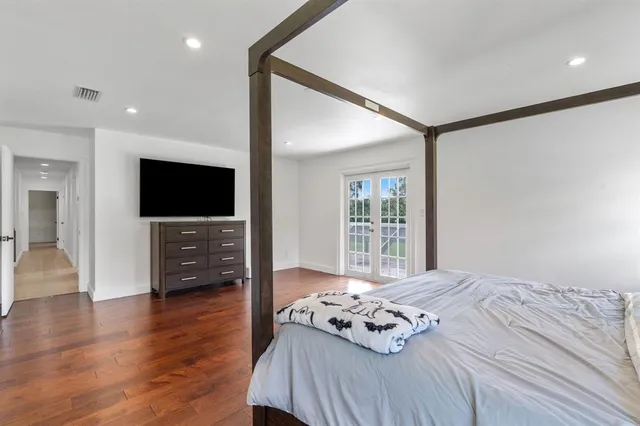 a dining room with furniture and floor to ceiling window