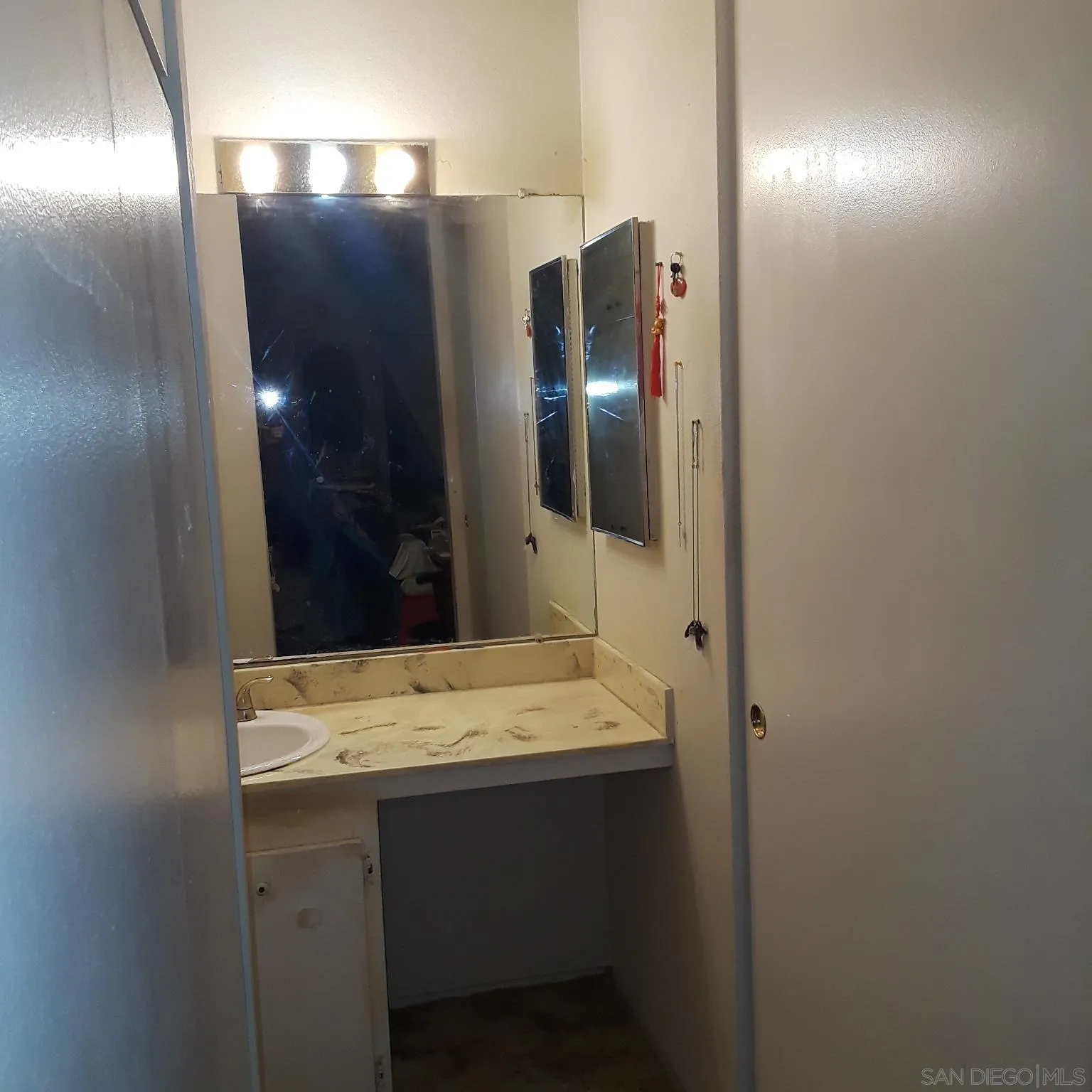 3550 Ruffin Road, Unit 233 San Diego, CA 92123 - Photo 13 of 17 a bathroom with a sink and a mirror