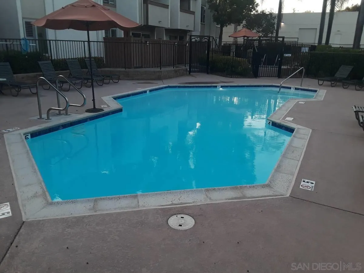 3550 Ruffin Road, Unit 233 San Diego, CA 92123 - Photo 16 of 17 an outdoor space with pool and furniture