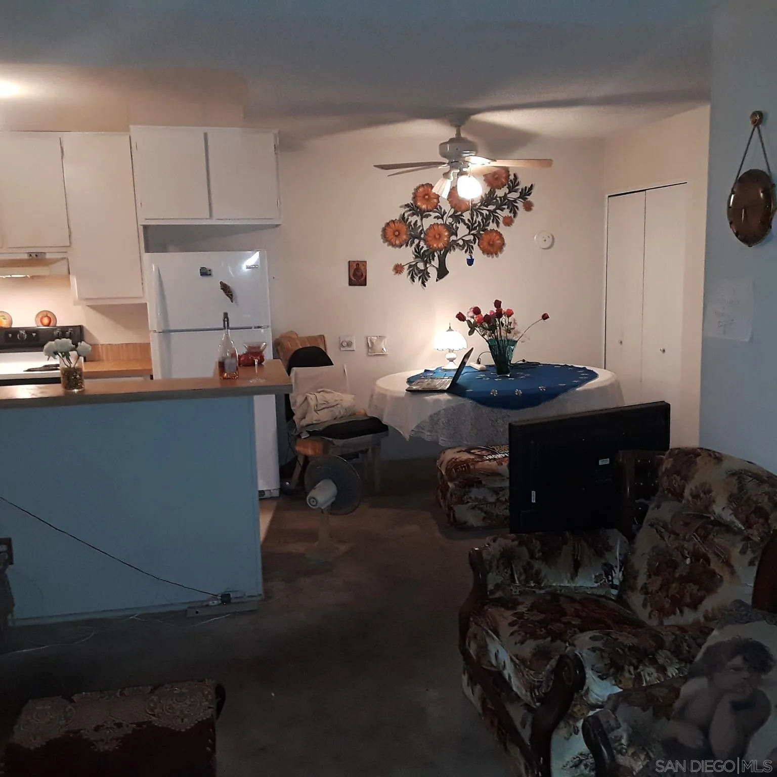 3550 Ruffin Road, Unit 233 San Diego, CA 92123 - Photo 10 of 17 a living room with furniture and a chandelier