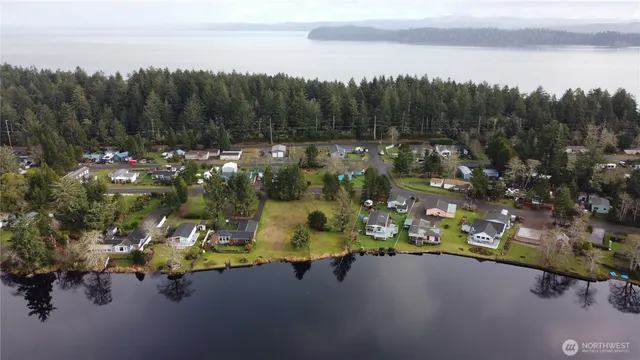 a view of a hallway with furniture and a potted plant