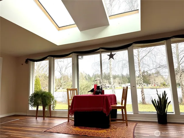 a kitchen with a sink a stove cabinets and a window