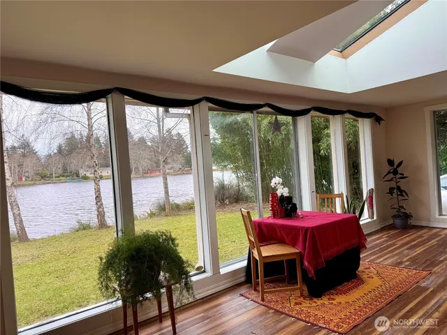 a room with wooden floors and bed