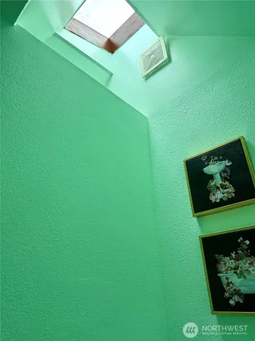 a view of room with window and ceiling fan