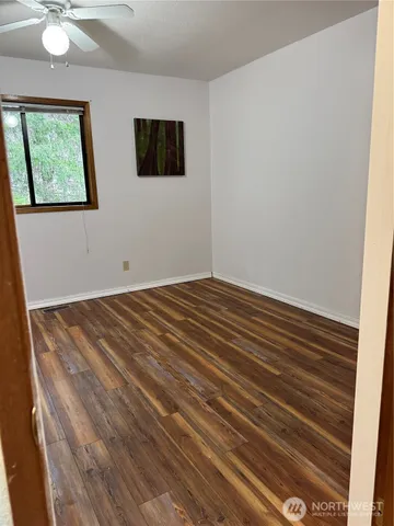 a bathroom with a sink toilet and mirror