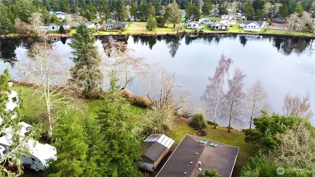 an aerial view of a house with yard
