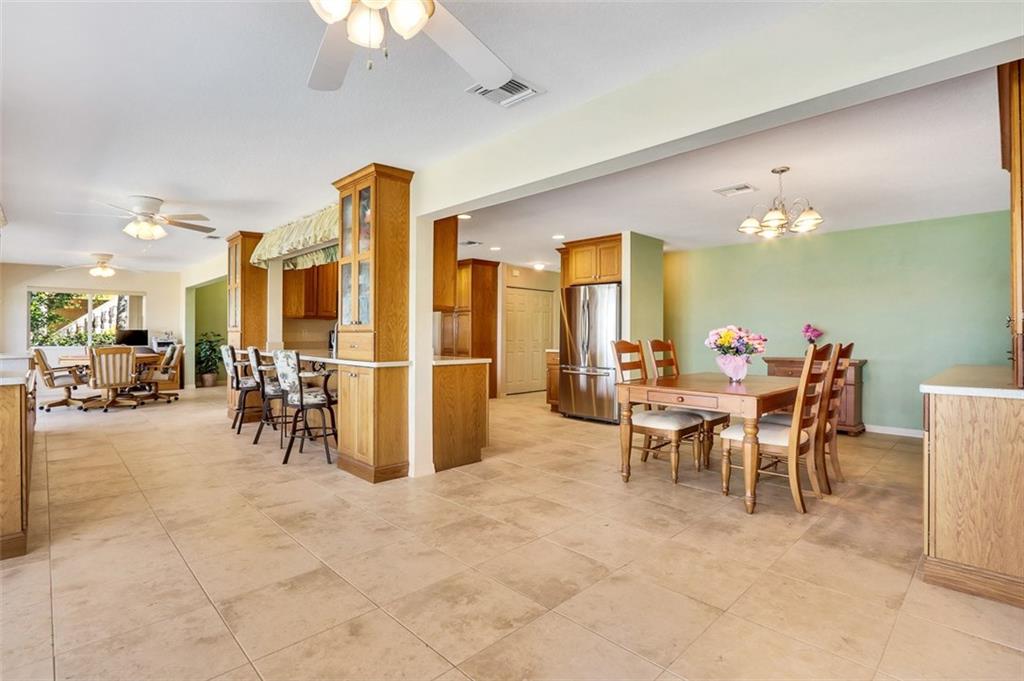 719 Southeast Riverside Drive Stuart, FL 34994 - Photo 6 of 17 a view of a dining room with furniture