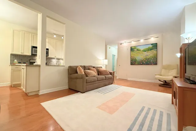 a picture of a book and a white bed