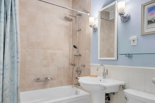 a bedroom with a bed and flat screen tv