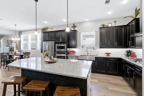 a kitchen with lots of counter space and appliances