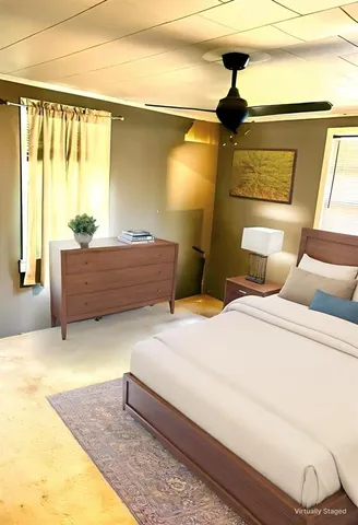 a bedroom with a bed and window