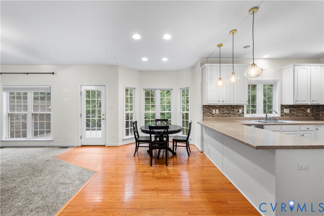 1301 Hawkins Wood Circle Midlothian, VA 23114 - Photo 16 of 50 a large kitchen with a table and chairs